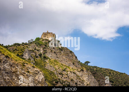 Facade and dome of the Tindari Sanctuary, built on a cliff with sheer drop on the sea and panoramic views of the Aeolian Islands and the gulf of Patti Stock Photo