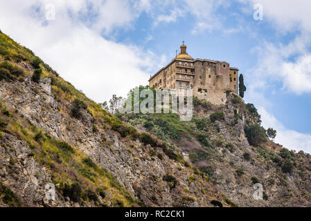 Facade and dome of the Tindari Sanctuary, built on a cliff with sheer drop on the sea and panoramic views of the Aeolian Islands and the gulf of Patti Stock Photo