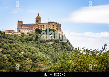 Facade and dome of the Tindari Sanctuary, built on a cliff with sheer drop on the sea and panoramic views of the Aeolian Islands and the gulf of Patti Stock Photo