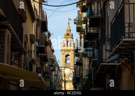 Bell tower of the Church of St. Ignatius at Olivella seen from Piazza Verdi across Via Orologio opposite Massimo theatre, Palermo, Sicily. Stock Photo