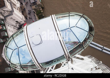 London, United Kingdom - October 31, 2017: Tourists are in the cabin of London Eye giant Ferris wheel mounted on the South Bank of River Thames in Lon Stock Photo