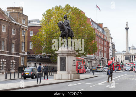 London, United Kingdom - October 31, 2017: Tourists are on the street near Equestrian statue of the Duke of Cambridge, Whitehall. Architect John Belch Stock Photo