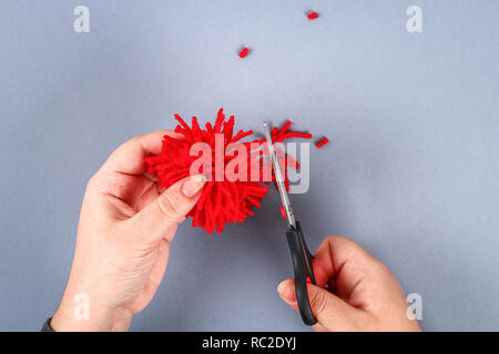 Red handmade diy monster pom pom from yarn, chenille stems in shape heart. Gift ideas for Valentines Day, day of love, the of February 14. Ste Stock Photo - Alamy