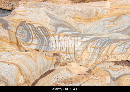 Patterns created by sea erosion on rocks at Rumbling Kern, near Howick ...