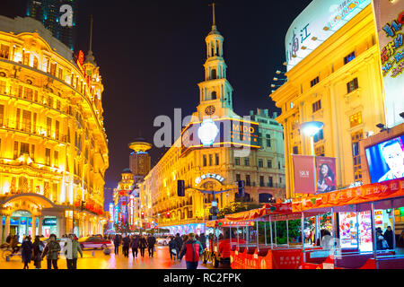 SHANGHAI, CHINA - DECEMBER 28, 2016: Illuminated cityscape with people walking at shopping street of downtown Stock Photo