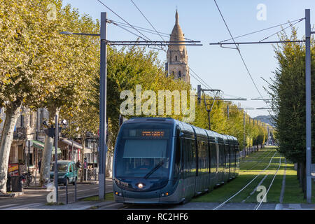 Bordeaux, France - 27th September, 2018: Tram passing through tree lined streets in the city of Bordeaux.