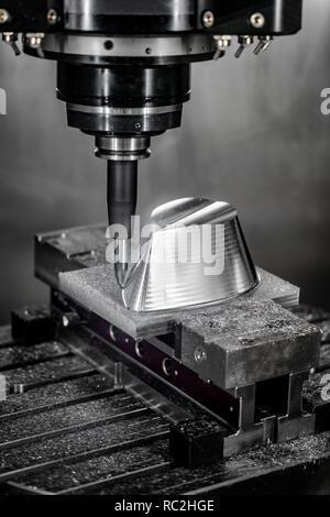 Metalworking CNC milling machine. Cutting metal modern processing technology. Small depth of field. Warning - authentic shooting in challenging condit Stock Photo