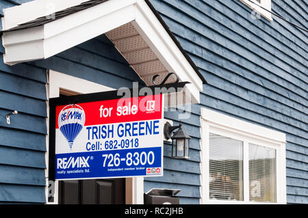 A For Sale sign on a house in St John's, Newfoundland, Canada. Stock Photo