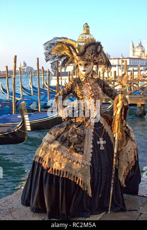 Venice, Italy - February 10, 2018: Person in a traditional venetian costume attends the Carnival of Venice Stock Photo