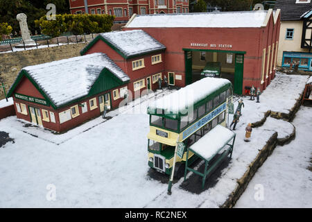 Bekonscot Bus Station at Bekonscot Model Village, Beaconsfield, Buckinghamshire, UK. Snowy day in winter Stock Photo