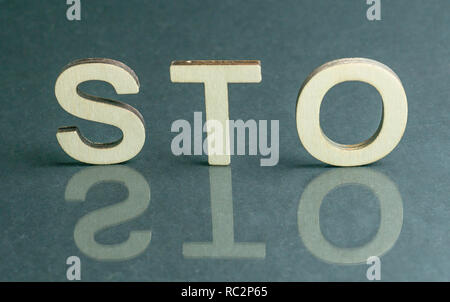 Security Token Offering STO sign with wooden letters, Ethereum concept Stock Photo
