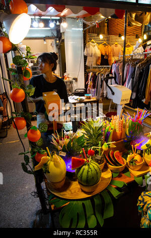 Chatuchak Market sells many different kinds of goods, including plants, antiques, consumer electronics, cosmetics, pets, food and drinks, fresh and dr Stock Photo