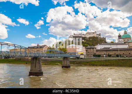 View of Hohensalzburg castle (Festung Hohensalzburg) and Mozart bridge (Mozartsteg) from Giselakai on right side of Salzach river. Salzburg, Austria Stock Photo