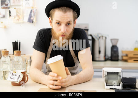 Handsome barista in hat Stock Photo