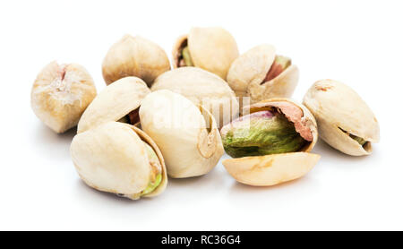 heap of ripe dry pistachios isolated on white background Stock Photo