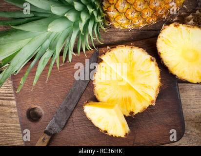 fresh pineapple sliced on wooden background Stock Photo