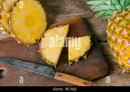 fresh pineapple sliced on wooden background Stock Photo
