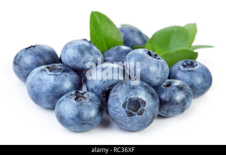 heap of fresh ripe organic blueberry with leaves isolated on white background Stock Photo