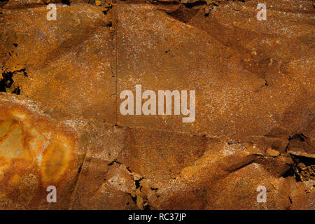 sheets of dry rusted metal from side of coroded galvanised bucket. Stock Photo