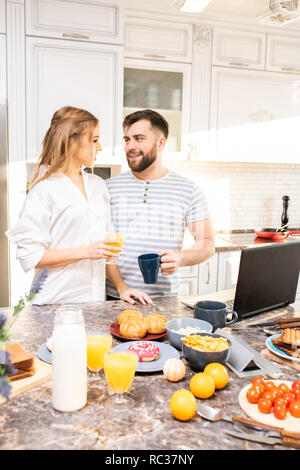 Young Couple Enjoying Breakfast Together Stock Photo