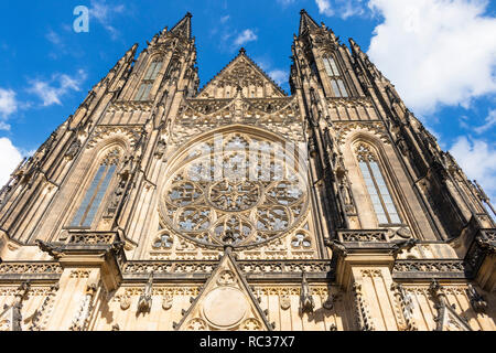 Prague St Vitus's cathedral looking up at the two towers and glazed window of the west doorway Prague castle Prague Czech republic Stock Photo