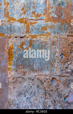 Rusted stone wall. Aged Mediterranean stone wall. Medieval architecture. Stock Photo