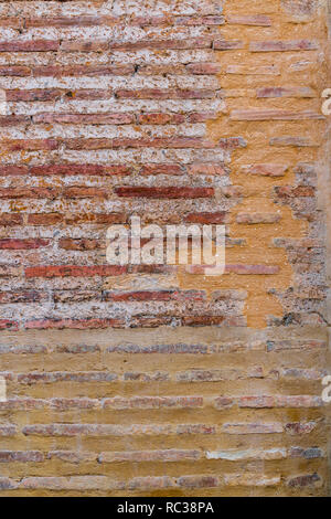 Red Brick  wall. Mediterranean style. Aged wall. Concrete and bricks. Stock Photo