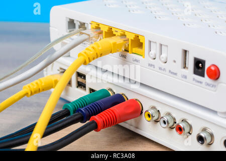 modern internet router with connecting cables, close up Stock Photo