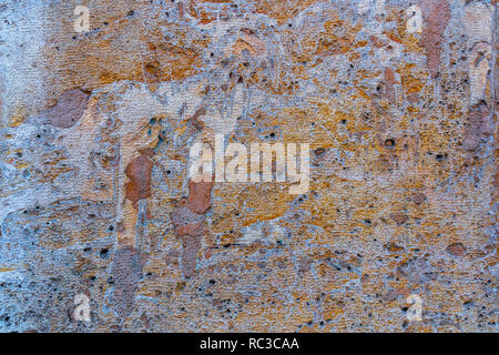 Rusted stone wall. Aged mediterranean stone wall. Medieval architecture. Stock Photo