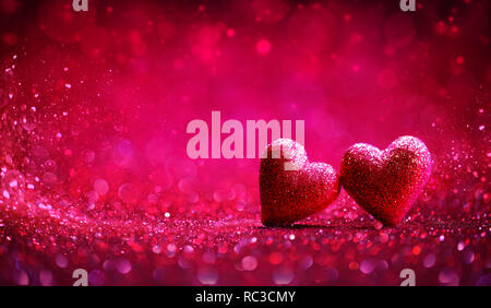 Two Red Hearts In Shiny Background - Valentine's Day Stock Photo