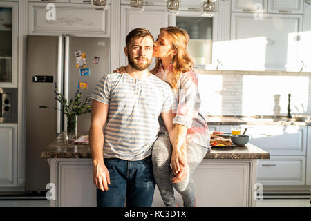 Happy Young Couple Posing at Home Stock Photo