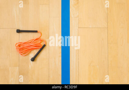 jump rope on wooden background. The view from the top Stock Photo