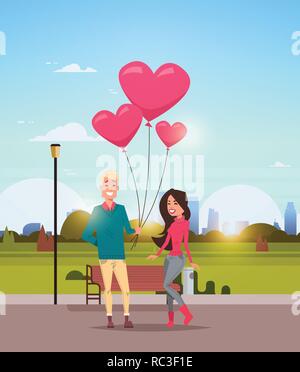 man giving woman pink heart shape air balloons happy valentines day concept young couple in love over city urban park cityscape background vertical flat Stock Vector