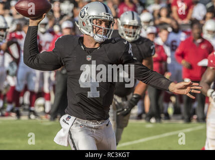 Oakland, California, USA. 30th Aug, 2015. Oakland Raiders quarterback Derek Carr (4) rolls out to make pass on Sunday, August 30, 2015 at O.co Coliseum in Oakland, CA. The Cardinals defeated the Raiders 30-23 in a preseason game. Credit: Al Golub/ZUMA Wire/Alamy Live News Stock Photo