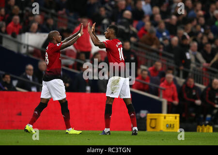 London, UK. 13th Jan, 2019. Marcus Rashford of Manchester Utd celebrates with teammate Ashley Young after he scores his teams 1st goal. EPL Premier League match, Tottenham Hotspur v Manchester Utd at Wembley Stadium in London on Sunday 13th January 2019. this image may only be used for Editorial purposes. Editorial use only, license required for commercial use. No use in betting, games or a single club/league/player publications . pic by Andrew Orchard/Andrew Orchard sports photography/Alamy Live news Credit: Andrew Orchard sports photography/Alamy Live News Stock Photo