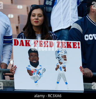 January 12, 2019 - Los Angeles, California, U.S - Rapper Post Malone and a  woman watch the Los Angeles Rams play the Dallas Cowboys in a NFC  Divisional playoff game at the