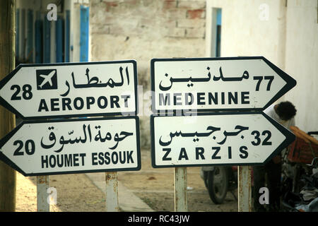 Signposts to Aeroport, Medenine, Zarzis and Houmet Essouk Stock Photo