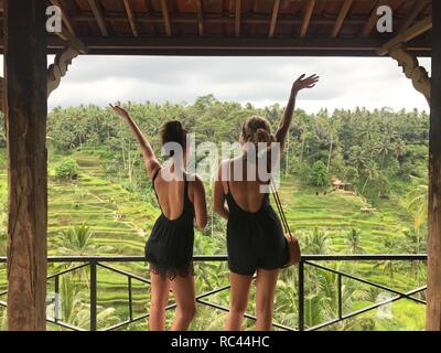 Two girls overlooking rice terraces Stock Photo