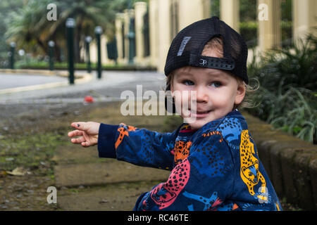 A portrait of a funny looking boy playing in the park Stock Photo