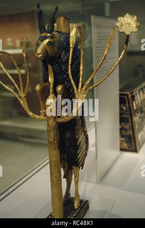 The Ram in a Thicket. Rampant Ram perched on the tree of life, covered with gold leaf. The horns, eyes and back of the animal are of lapis lazuli. The base on silver. Possibly served as a offerings pedestal or a harp motif. Found at a pit PG 1237 of the Royal Cemetery of Ur. 2600-2400 BC. British Museum. London. United Kingdom. Stock Photo