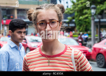 A portrait of a beautiful geeky looking girl with interesting braids Stock Photo