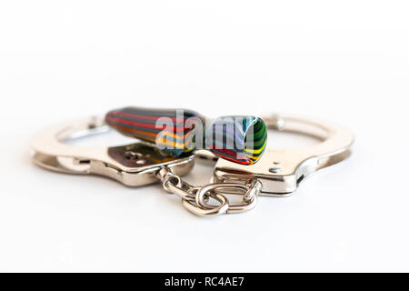 Concept of illegal pot smoking with handcuffs isolated Stock Photo