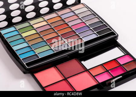 Decorative cosmetics, eye shadow makeup set in professional black holder, viewed in close-up from high angle, on white background Stock Photo