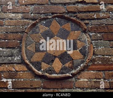 Italy. Pompeii. Medallion. Geometrical decoration, star. Decorative detail , exterior wall of a Roman dwelling. Made in terracotta mosaic. Located at the junction between Street of Abundance and Theatre Street. Campania. Stock Photo