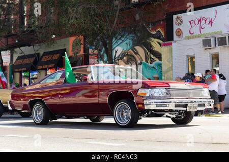 Chicago, Illinois, USA - September 15, 2018: Pilsen Mexican Independence Day Parade, chevrolet, lowrider, carrying the mexican flag Stock Photo