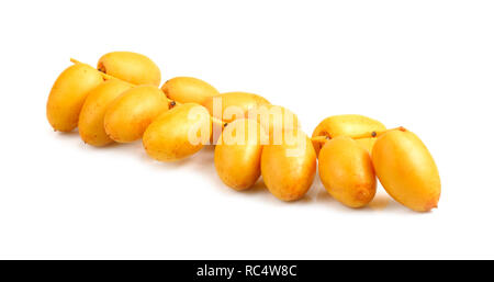 Bunch of yellow raw date fruit or medjool dates (Phoenix dactylifera) from the palm tree isolated on white background. Stock Photo