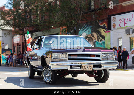Chicago, Illinois, USA - September 15, 2018: Pilsen Mexican Independence Day Parade, A lowrider, with the mexican flag, going down the street Stock Photo