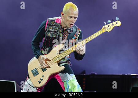 Flea of Red Hot Chili Peppers playing his Fender Jazz Bass guitar at a live music festival. RHCP bass guitarist, Flea bassist, Michael Peter Balzary. Stock Photo