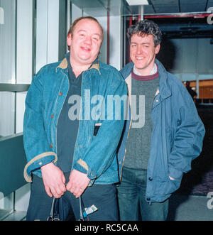 Mel Smith and Griff Rhys Jones leaving Heathrow in January 1989. Stock Photo