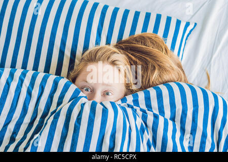 Morning of young pregnant woman suffering from toxicosis at home Stock Photo